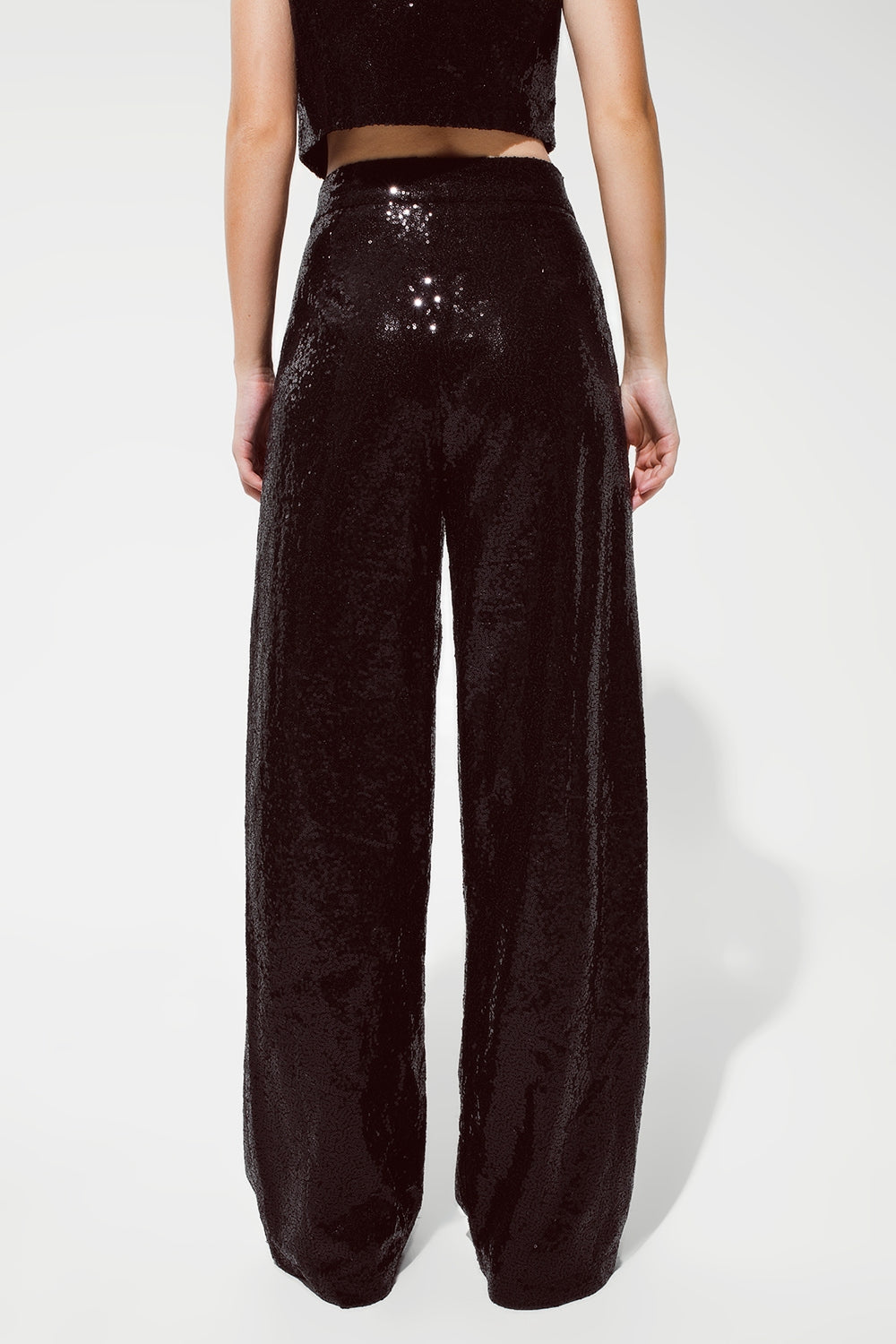 Pantalon noir à paillettes avec jambes évasées