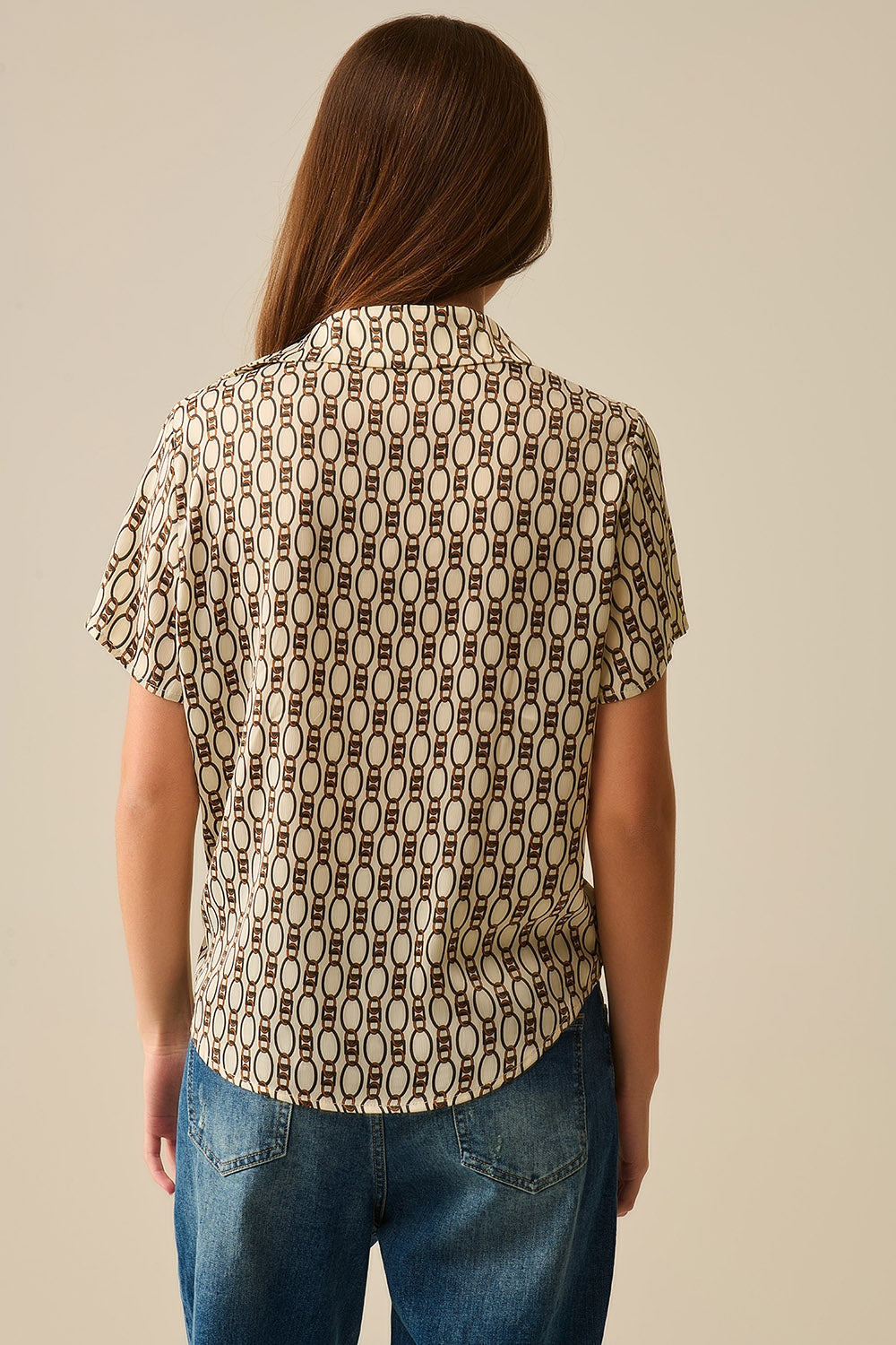 Polo beige à manches courtes imprimé chaîne