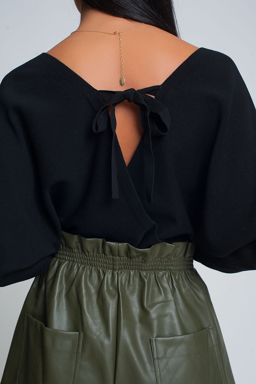 Pull en maille avec col en V enveloppé en noir