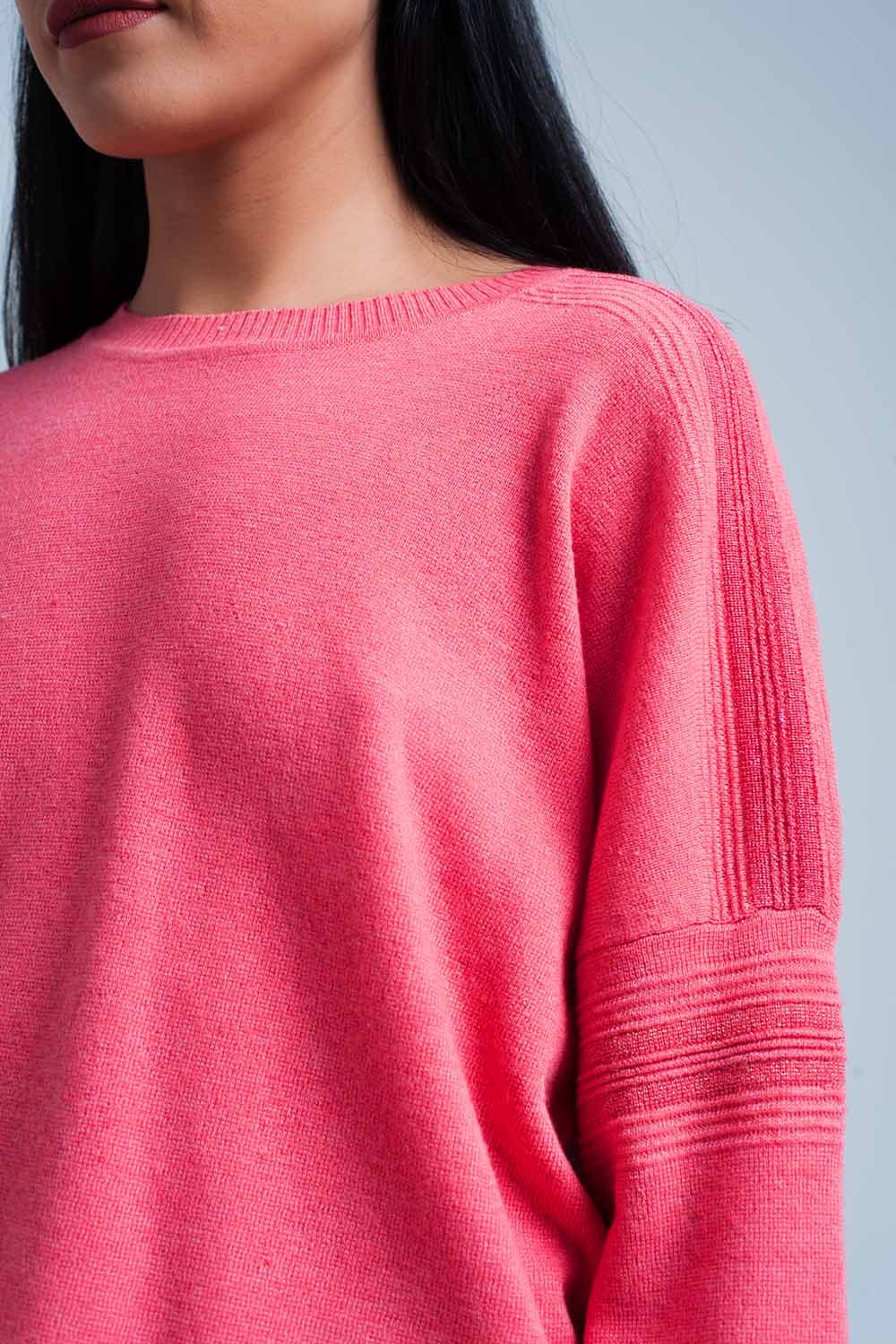 Pull fin tricoté corail avec détails du scintillement