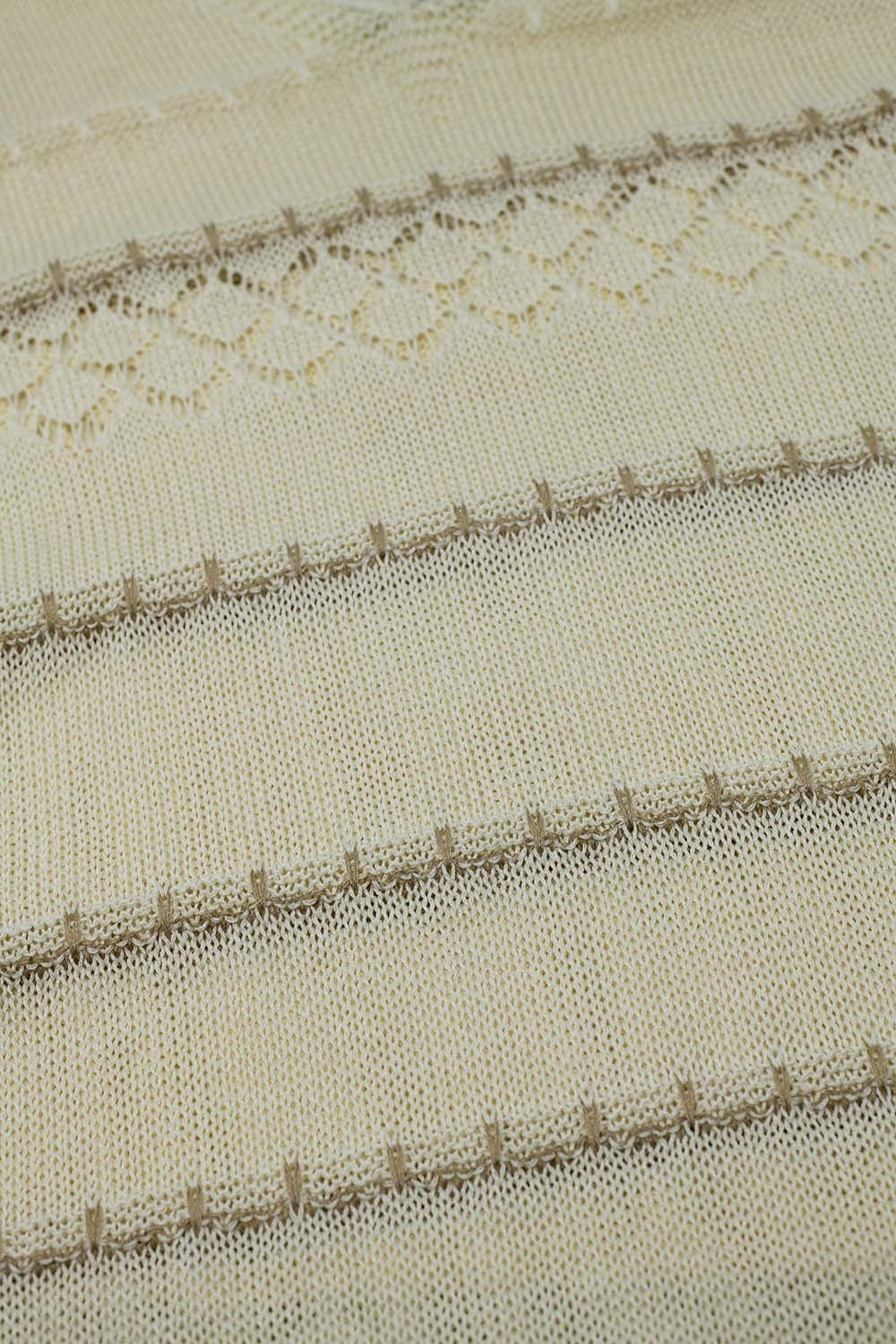 Robe midi sans manches à col en V et motif en crochet de couleur crème